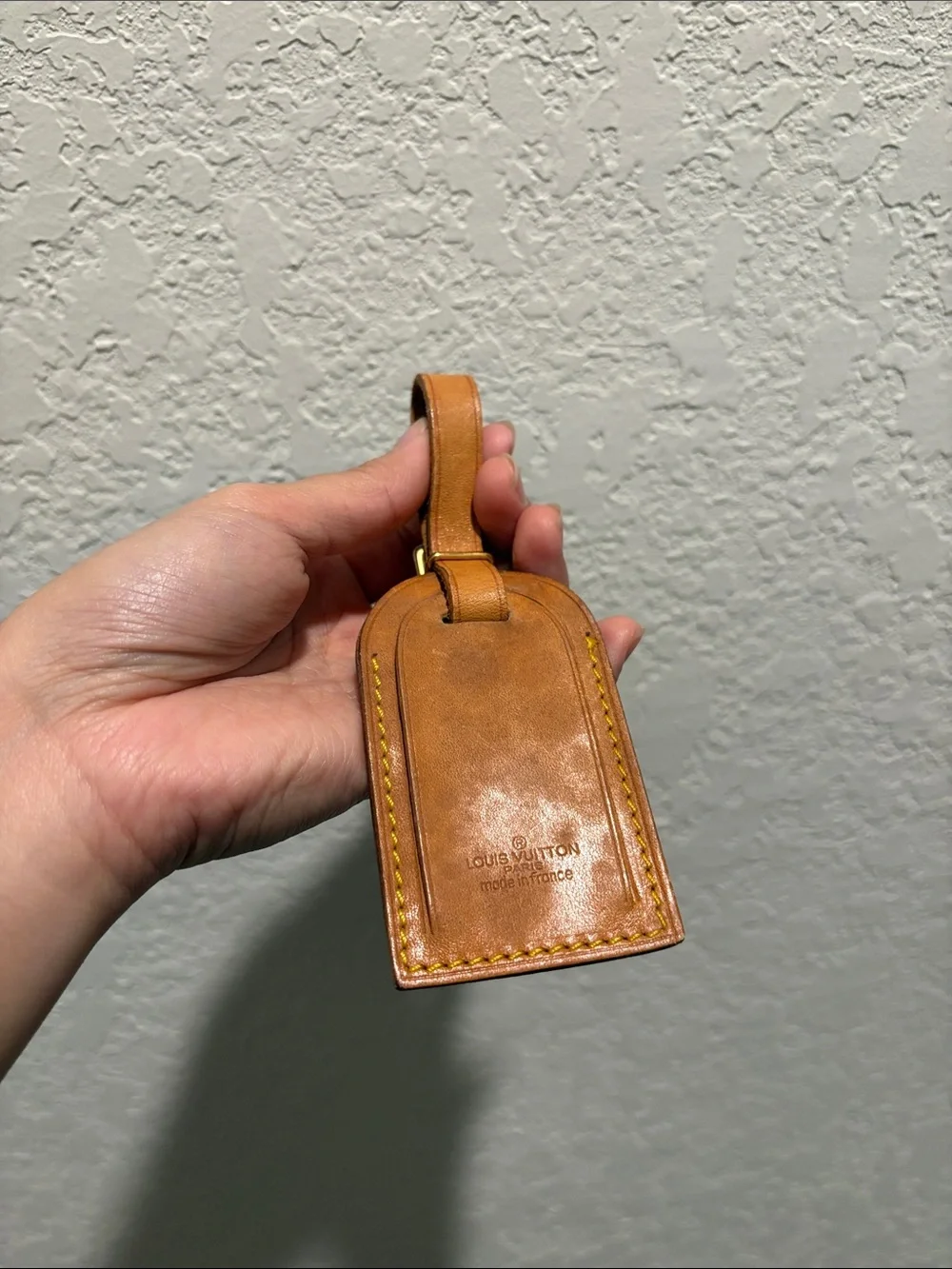 Louis Vuitton leather luggage tag.